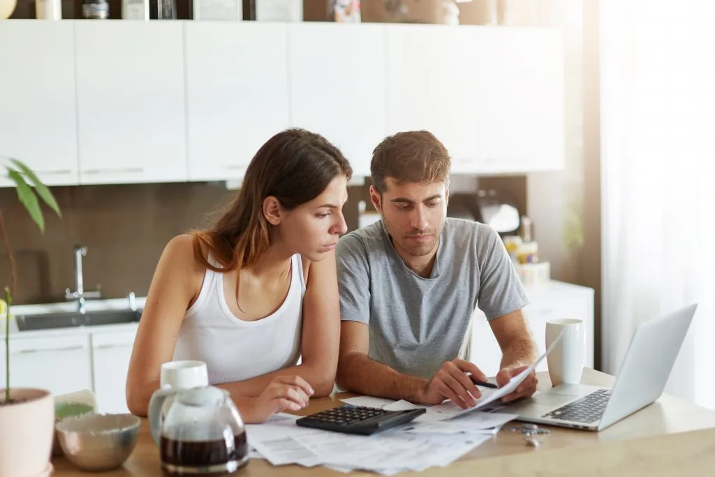 young-couple-checking-their-family-budget-1024x683