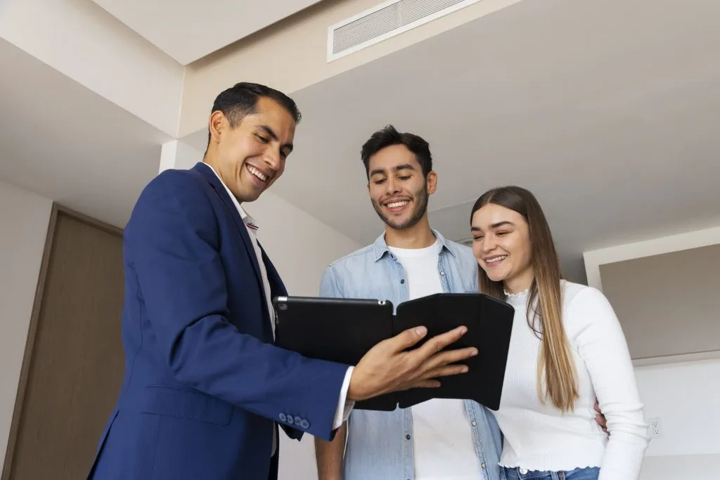 medium-shot-couple-talking-real-estate-agent-1-1024x683